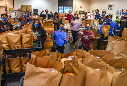 AHC volunteers packaging food for the community.